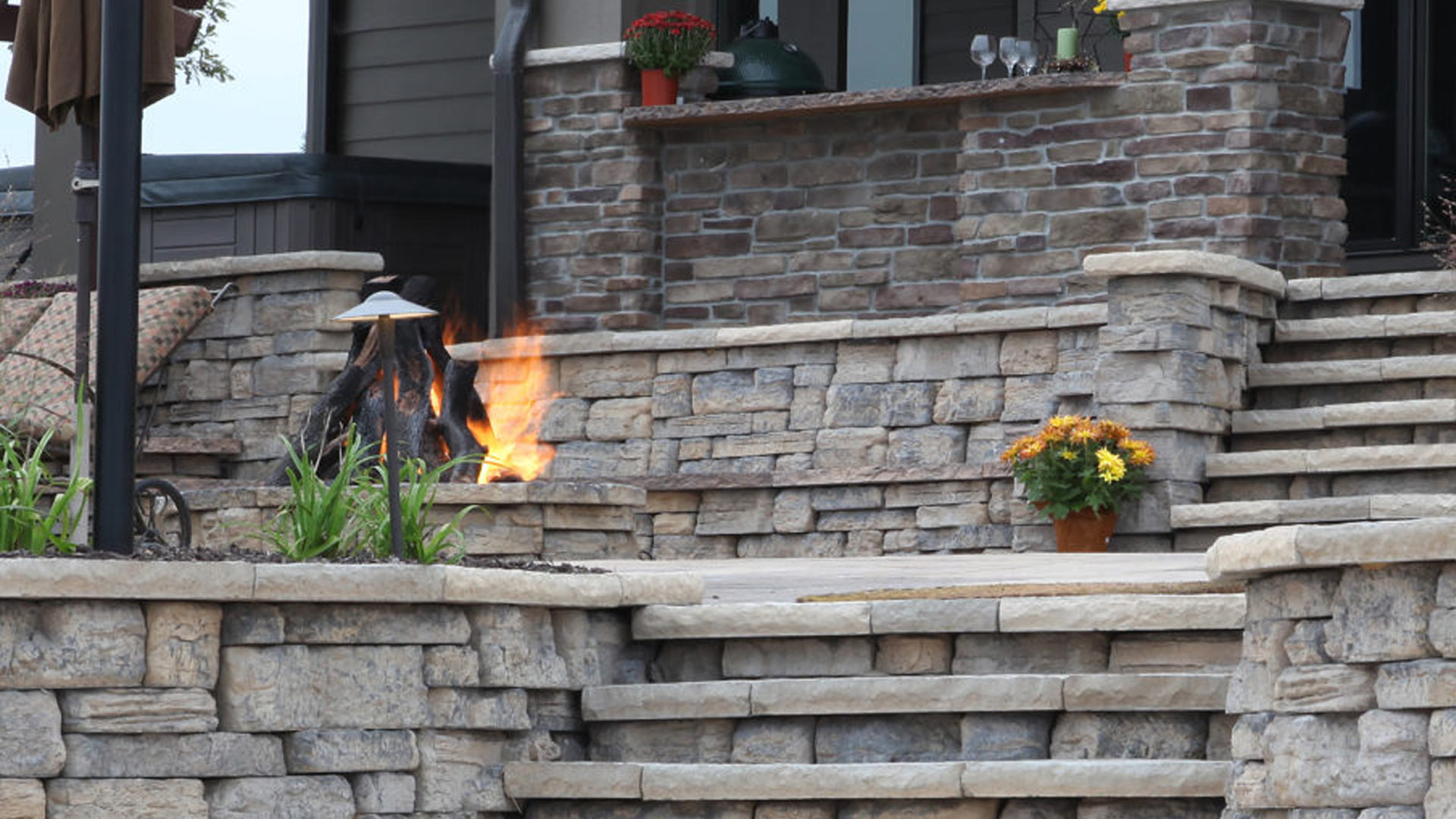 Backyard with firepit and steps installed in Millard, NE.
