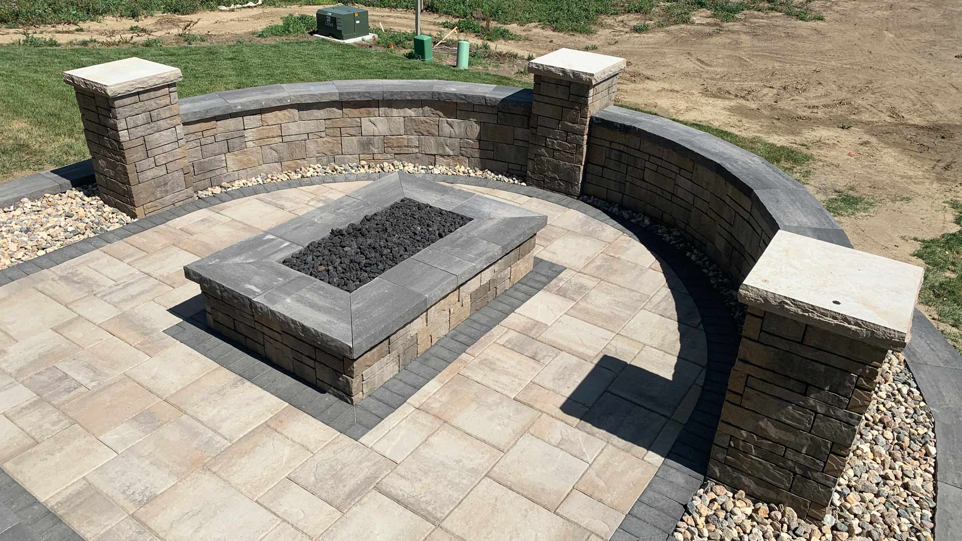 Firepit with seating wall installed in Omaha, NE.