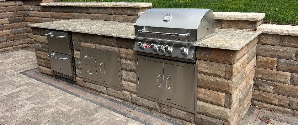 Block outdoor kitchen with stainless steel appliances in Omaha, NE.