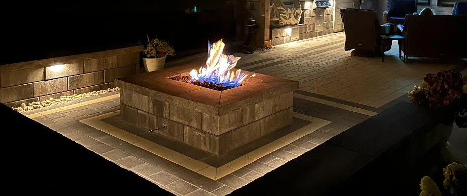 Gas-burning fire pit on a patio in Omaha, NE.