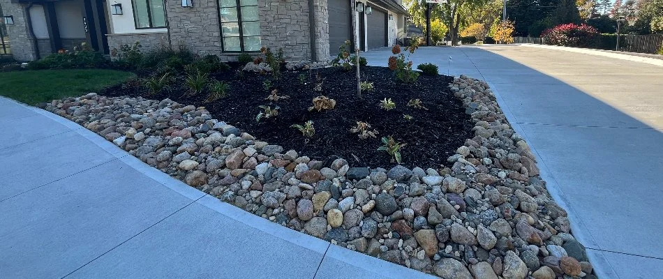 Landscape in Omaha, NE, with mulch and rock.