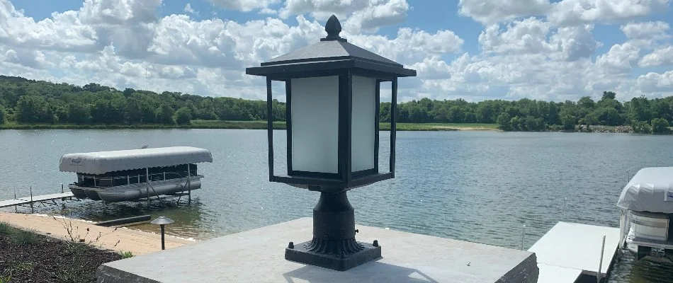 An LED light on a post near the water in Omaha, NE.