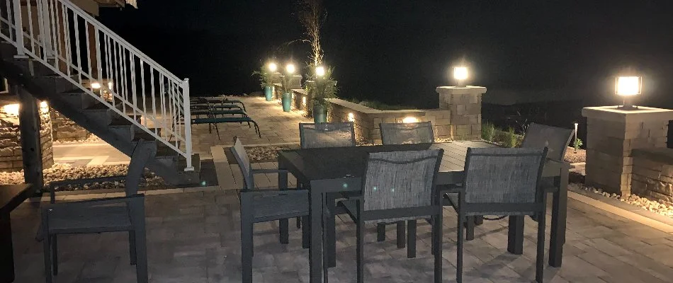 LEB bulbs surrounding a patio in Omaha, NE, with a table and chairs.