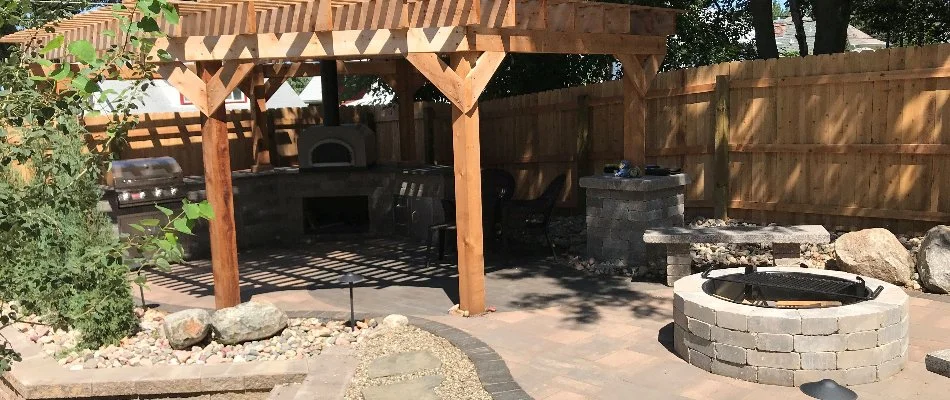 Patio area with a pergola on a property in Omaha, NE.