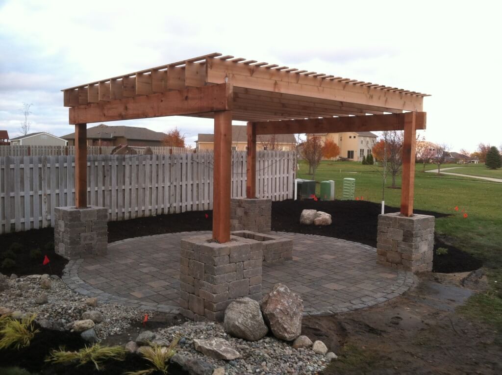 Outdoor pergola with paver patio not attached to existing structure