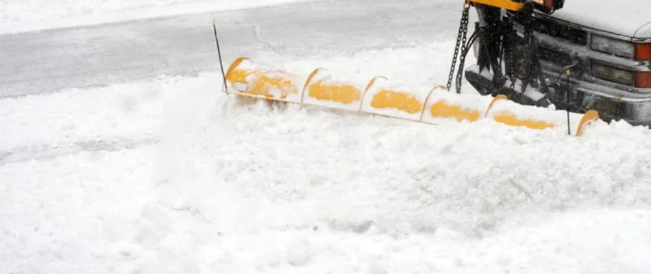 Plowing thick snow on a road in Omaha, NE.