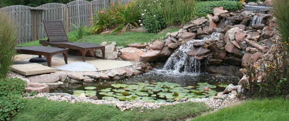 Pond in Omaha, NE, with waterfall.