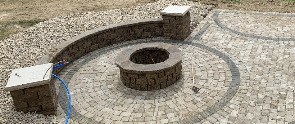 Seating wall on a patio with fire pit in Omaha, NE.