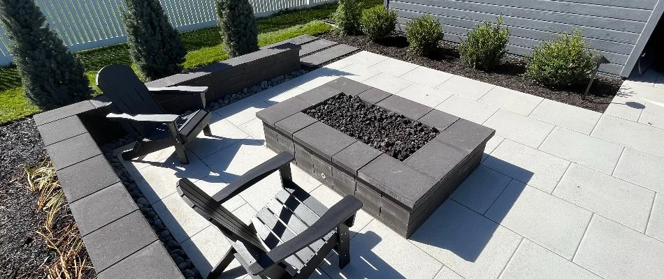 A square fire pit on a property in Omaha, NE.