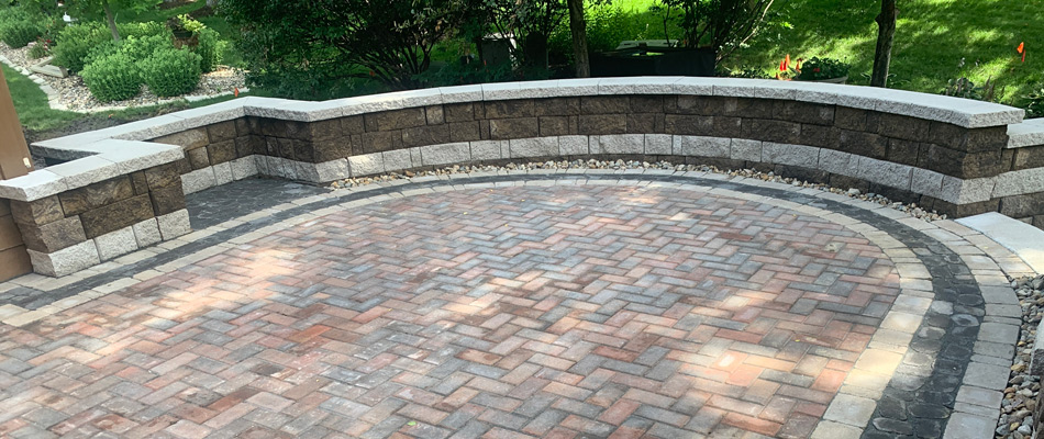 Black and gray stone materials built into seating wall in Waterloo, NE.