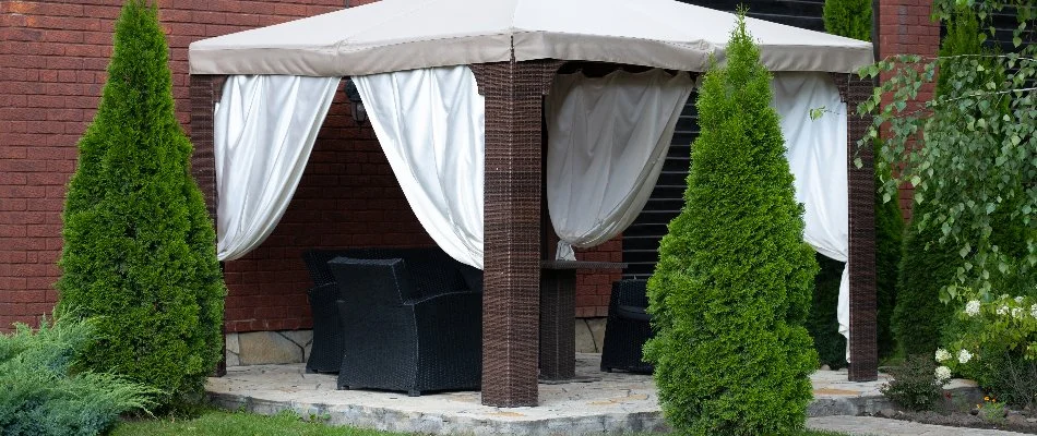 Cabana with chairs under it on a property in Omaha, NE.