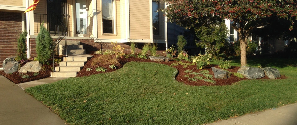 Edged landscape bed for service in Omaha, NE.