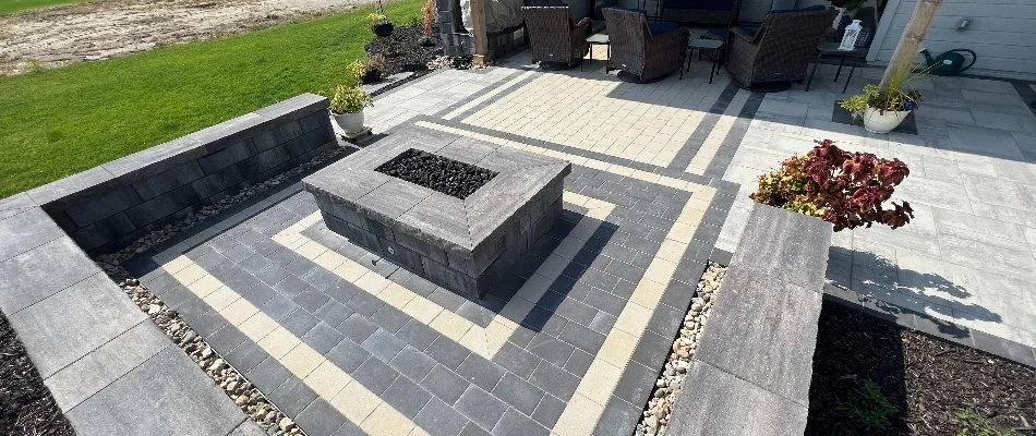Fire pit and a seating wall on a paver patio in Glenwood, IA.