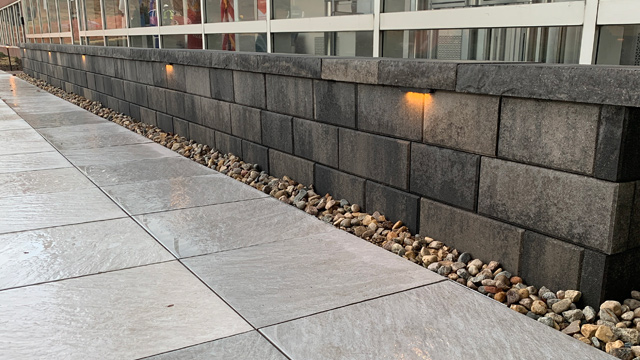 Landscape lighting installed for seating wall in Omaha, NE.