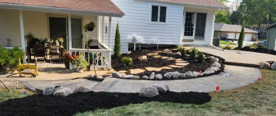 Landscape in Eagle, NE, with mulch along a walkway.