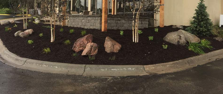 Mulching and plantings added to landscape bed in Lincoln, NE.