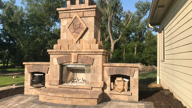 Outdoor fireplace installed over patio in Omaha, NE.
