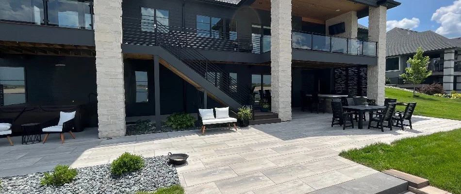 A patio on a property in Gretna, NE, with outdoor furniture.