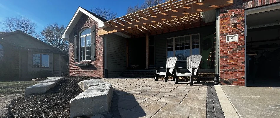 Patio in Springfield, NE, with a pergola and outdoor chairs.