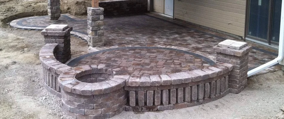Patio in Eagle, NE, with a seating wall.