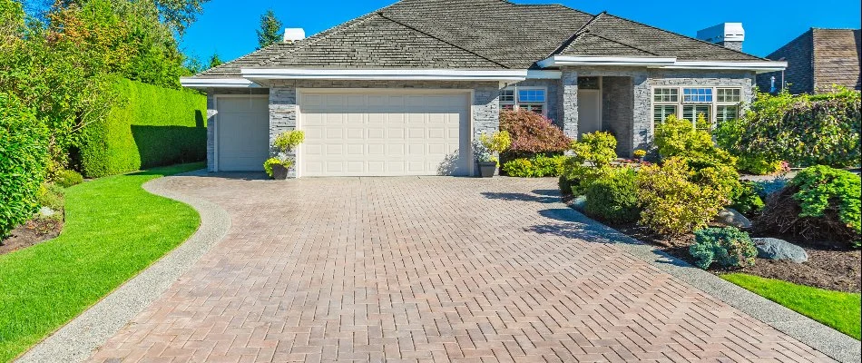 Paver driveway and nice landscaping in front of a home in Omaha, NE.