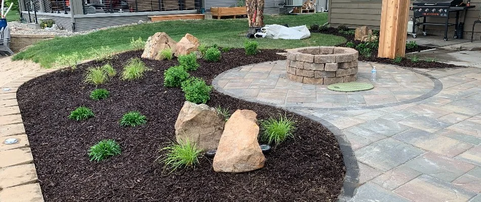 Pristine landscape bed in Weeping Water, NE, with mulch and plantings.