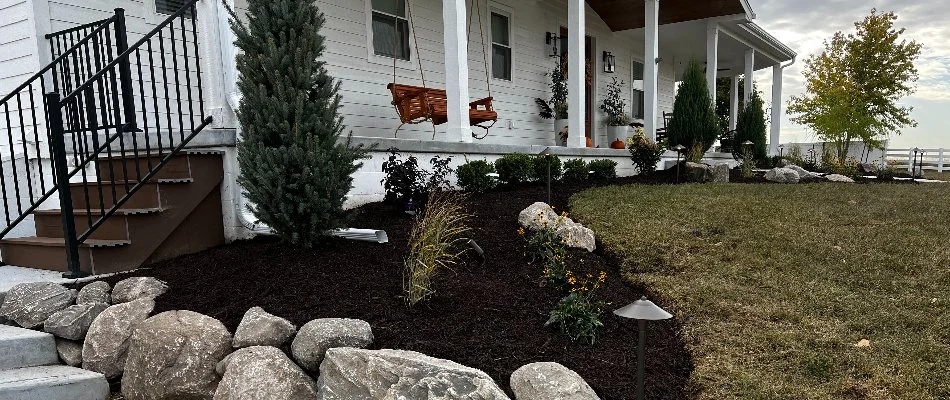 Pristine landscape in Yutan, NE, with black mulch and lush plants.