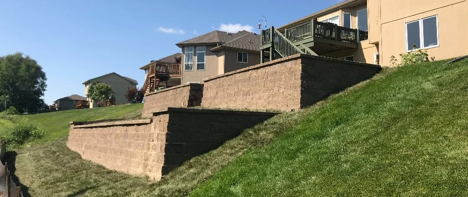 Two retaining walls in backyard located in Syracuse, NE.