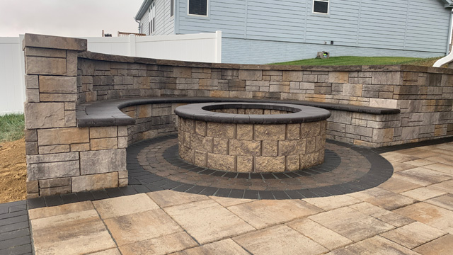 Seating wall installed around fire pit in Waterloo, NE.