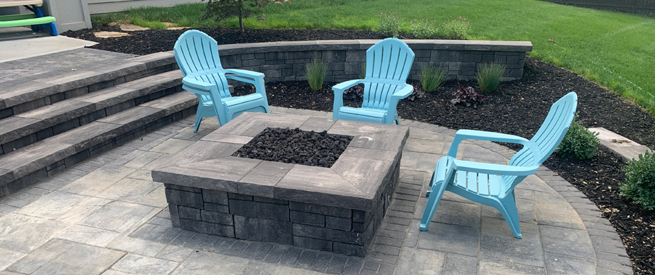 A square fire pit installed in lower level patio in Elkhorn, NE.