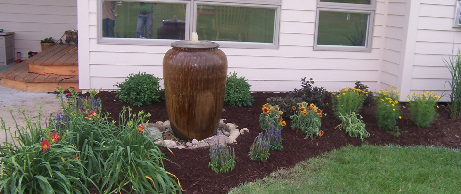 Water feature included in a landscape bed refresh in Papillion, NE.